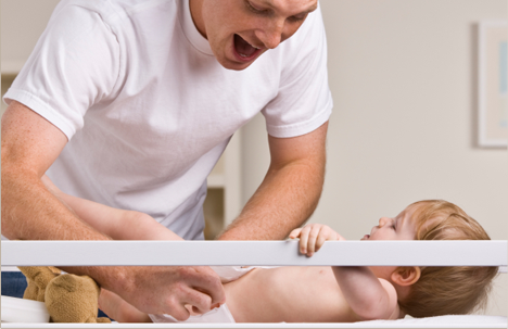 Dad changing a baby