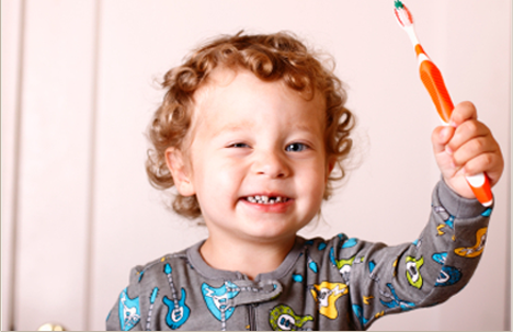 Toddler brushing his teeth