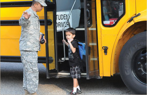 Preschooler getting off the school bus