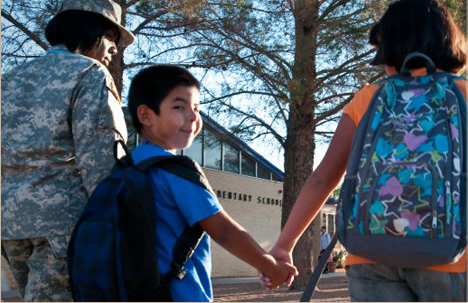 Mom and two children walking to school