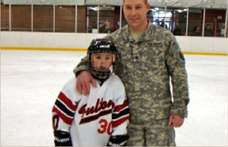 Dad with child at hockey game