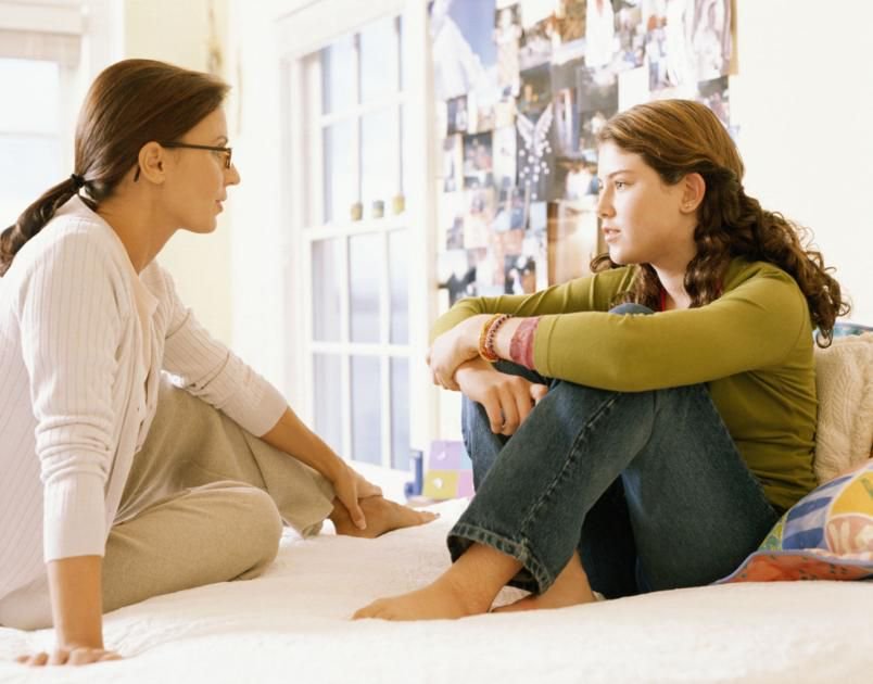 Mom talking to her daughter