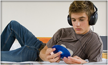 Teen boy listening to music.