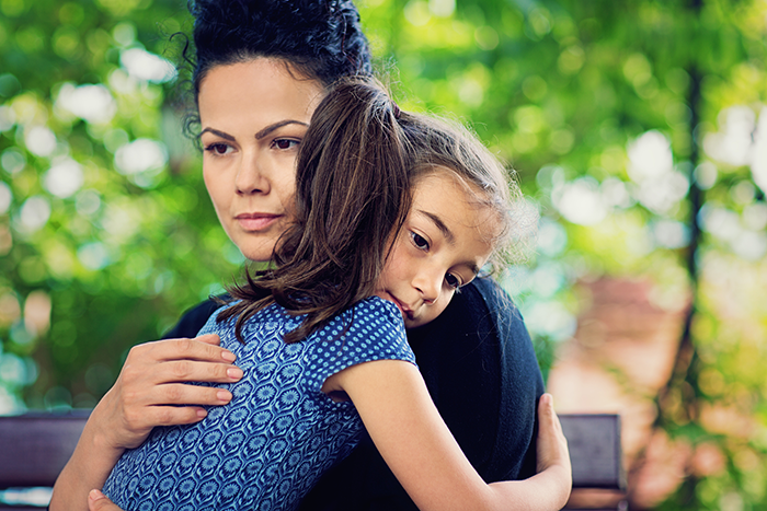 Mother holding her daughter