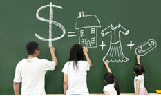 Family drawing their goals on a chalkboard