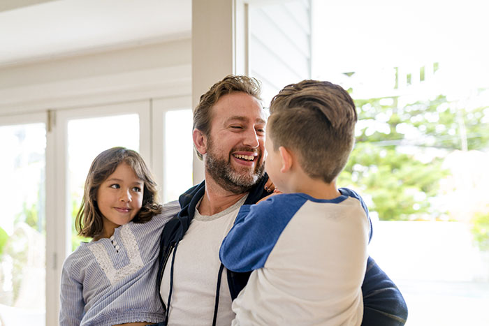 Dad playing with his kids