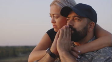 Image of a man and woman hugging and comforting one another.